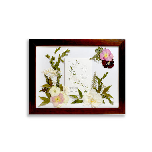 Walnut Pressed Floral Frame, a custom wedding flower preservation frame showcasing beautifully dried and pressed flowers arranged in a unique design.