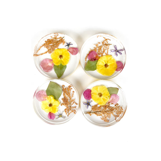 Set of 4 coasters featuring beautiful pressed flower designs, ideal for adding charm to your home decor.
