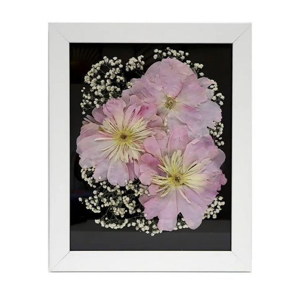 White Pressed Floral Frame showcasing a beautiful arrangement of preserved flowers, perfect for cherishing memories.