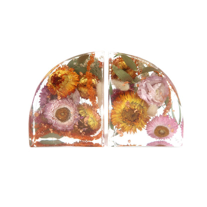 Elegant custom floral bookends made by Bloomsake, featuring beautiful dried flowers preserved in resin, each measuring 4x5 inches.