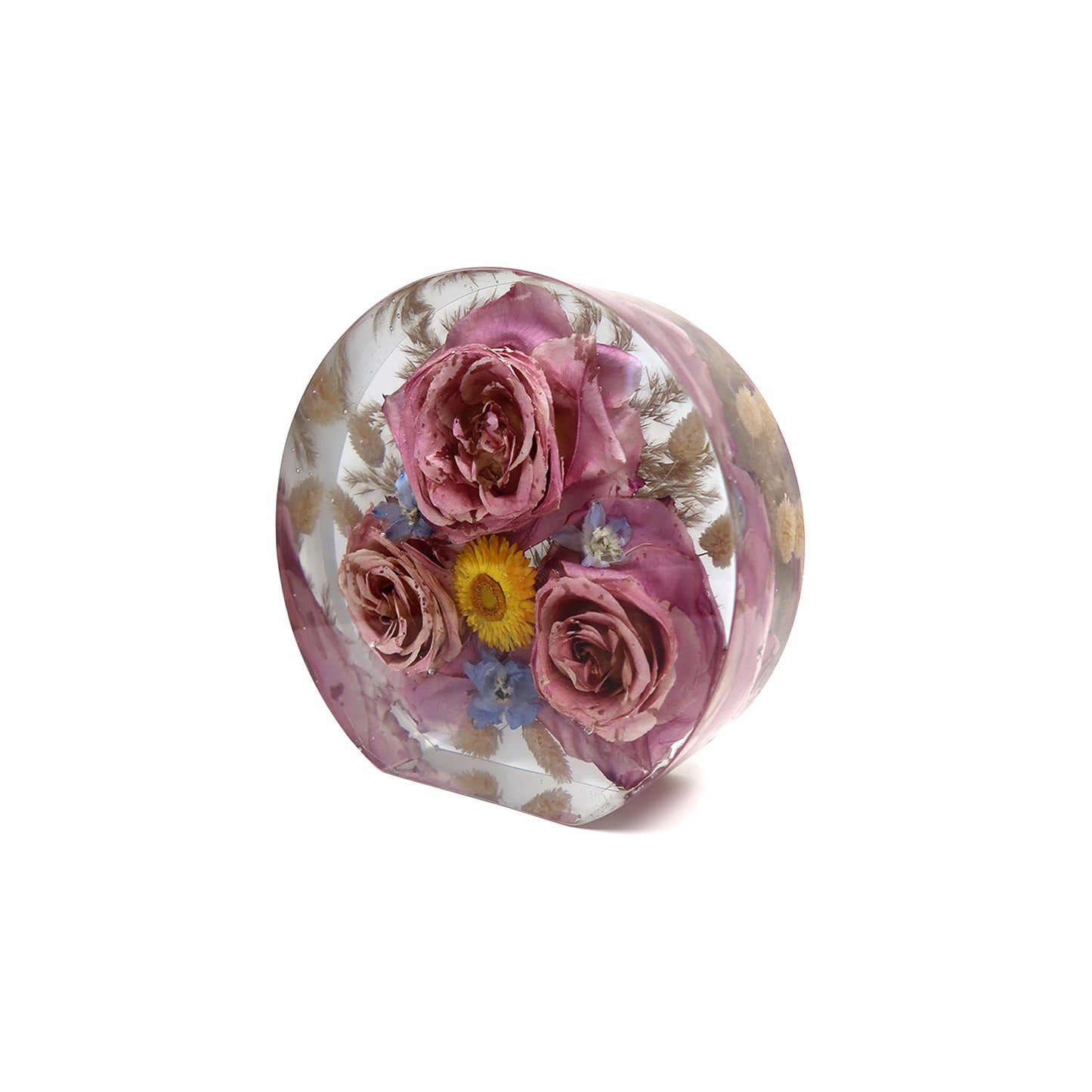 Close-up of Circle Block showcasing resin floral preservation technique with colorful flowers embedded beautifully in clear resin.