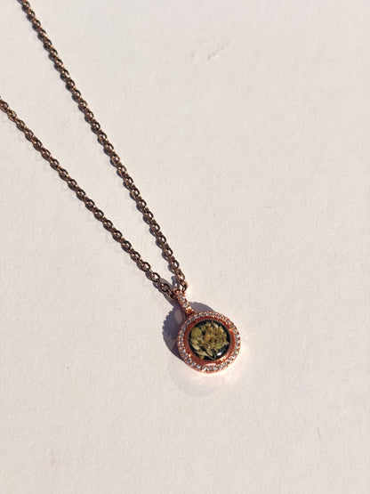 Close-up of the intricate details of the Aurora Necklace, a preserved flower necklace handmade by Bloomsake.