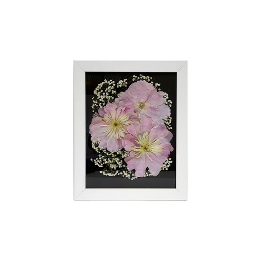 White Pressed Floral Frame showcasing a beautiful arrangement of preserved flowers, perfect for cherishing memories.