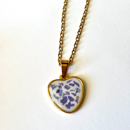 Bloomsake gold heart pendant necklace with purple flower petals preserved in white resin, full necklace view.