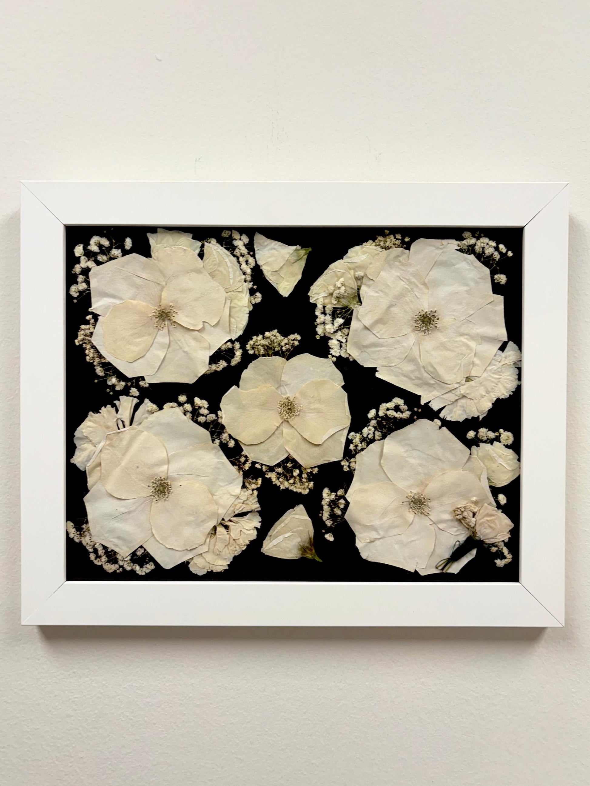 A beautiful White Pressed Floral Frame showcasing a custom preserved flower frame, designed to highlight your favorite blooms with timeless beauty.