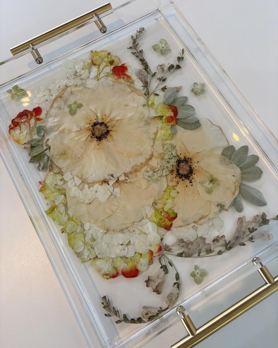 Resin tray keepsake made from preserved wedding bouquet flowers encased in clear acrylic, a functional everyday keepsake